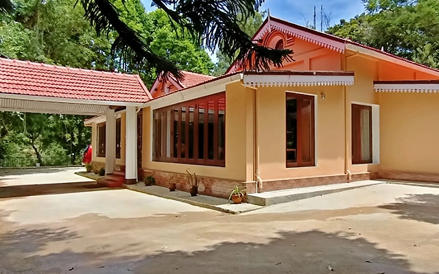 Book a peaceful stay at Shantiniketan Heritage Resort in Coonoor with vintage charm and modern comforts