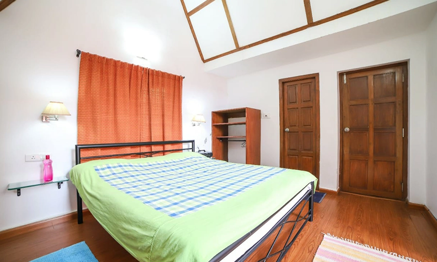 Experience a spacious and elegant luxury bedroom at Chalet Mon Ami, a peaceful retreat in Kotagiri hills.