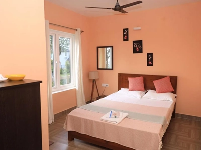 Experience elegant ambient lighting in the cozy bedroom at De Castle Villa in Coonoor for a warm stay