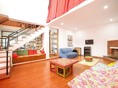 Relax in the stylish and spacious living room at Chalet Mon Ami Kotagiri with beautiful hilltop views.
