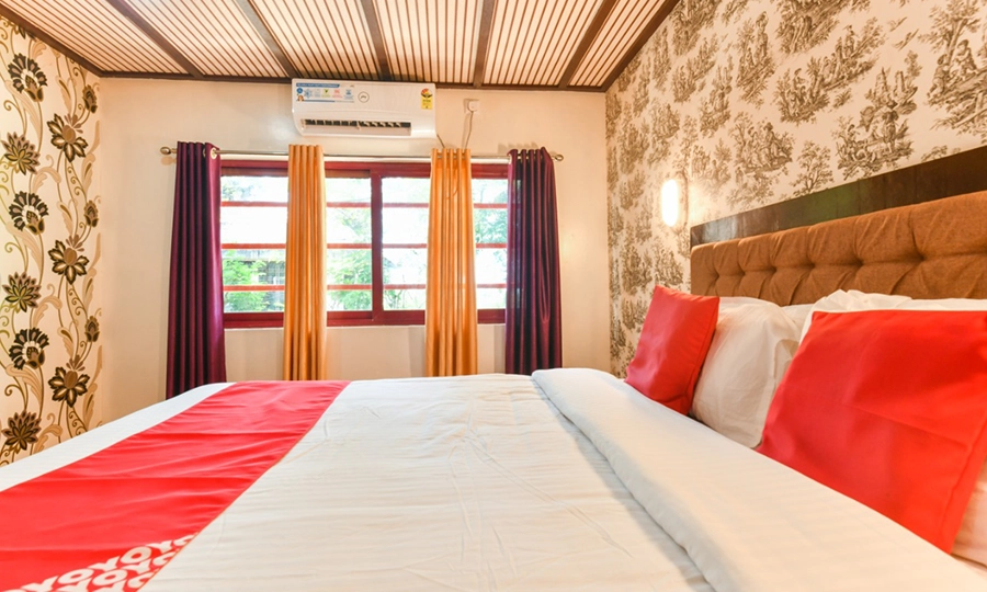 Relax in a cozy bedroom during your Kerala houseboat night stay with Indiavacationz backwater cruise