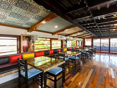 Experience Kerala backwaters with Indiavacationz in a houseboat featuring a spacious and scenic dinner hall