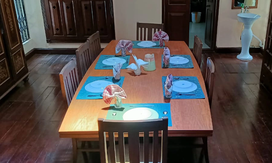 Traditional dining area at Shantiniketan Villa in Coonoor with vintage charm and spacious seating for guests