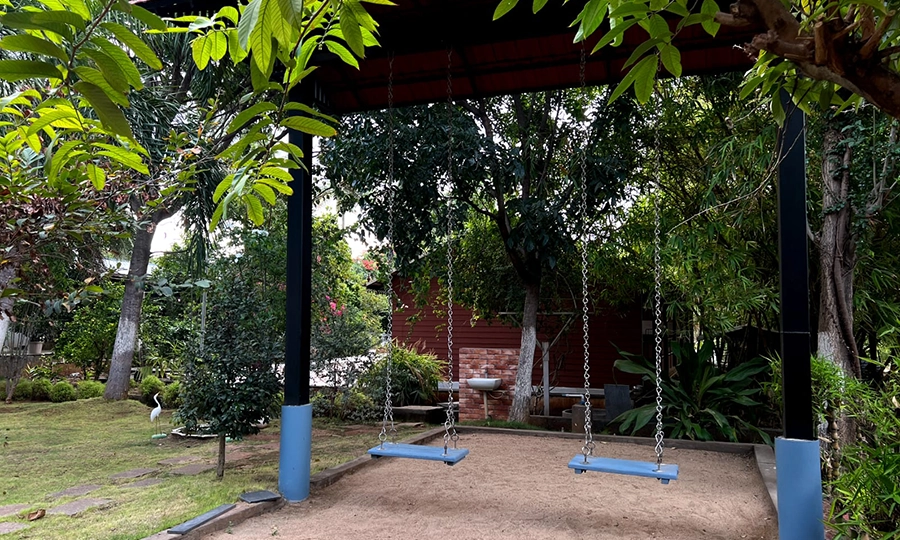 Let children play safely on swings and open lawns while parents unwind at peaceful farmhouse in Sulur