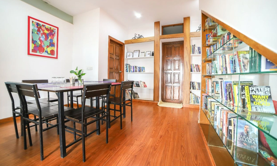 Enjoy a cozy, well-furnished living room with scenic hill views at Chalet Mon Ami in Kotagiri.