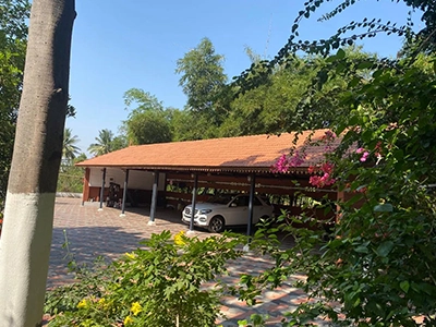 Use the shaded car parking area that offers security & convenience during stay at farmhouses Sulur.