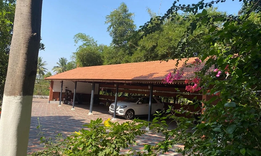 Use the shaded car parking area that offers security & convenience during stay at farmhouses Sulur.