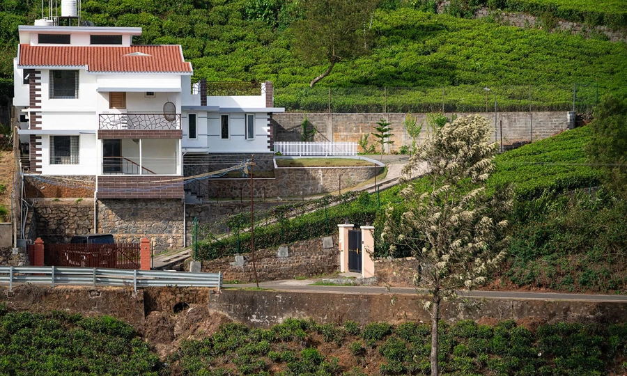 Fort-inspired space offering spacious bedrooms, pristine baths, and scenic mountain views in Kotagiri.