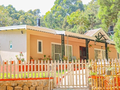 Fort-inspired space offering spacious bedrooms, pristine baths, and scenic mountain views in Kotagiri.