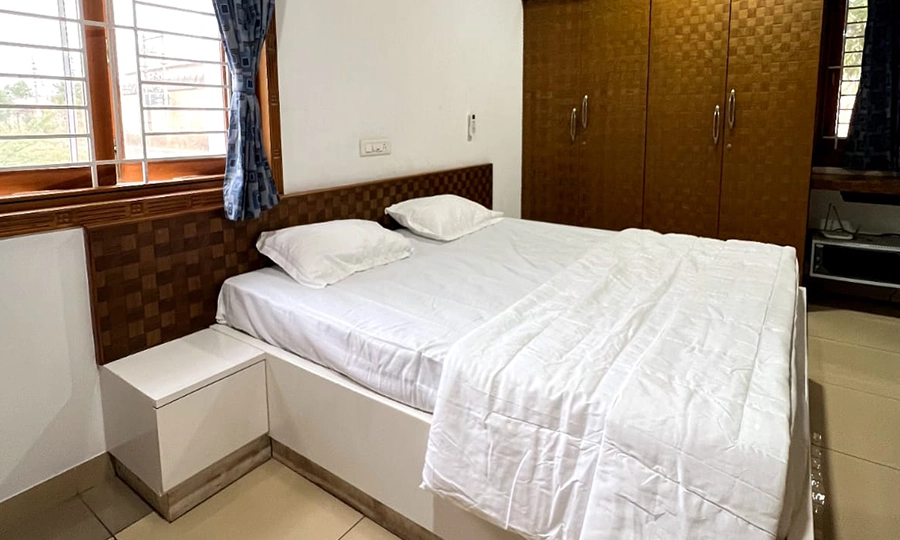 Sleep comfortably in luxury bedrooms with interiors and lighting at private farmhouse stays in Sulur