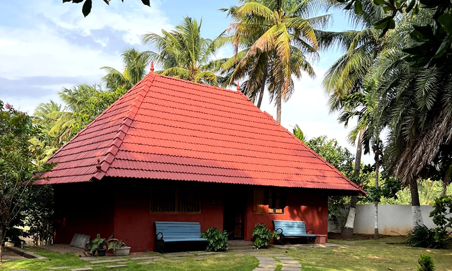 Enjoy a luxurious private farmhouse stay with lush greenery and serene surroundings in Coimbatore.