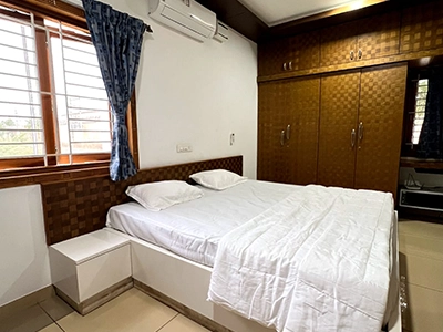 Sleep comfortably in luxury bedrooms with interiors and lighting at private farmhouse stays in Sulur
