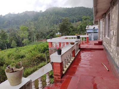 Relax on the top hill view balcony at Rico Retreat Kotagiri and soak in the scenic Nilgiri landscape