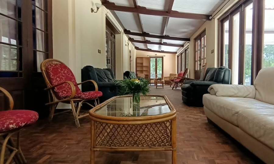 Spacious living hall with heritage decor at Shantiniketan Villa in Coonoor, ideal for family gatherings