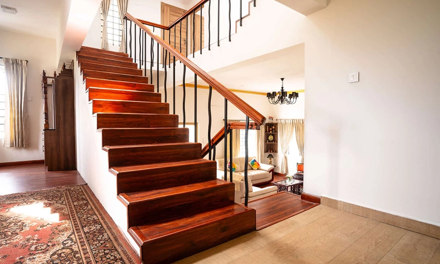 Walk up a bright, elegant staircase of airy living spaces, adding modern charm to the villa in Kotagiri.
