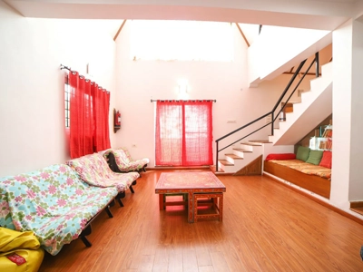 Enjoy a cozy and spacious living room at Chalet Mon Ami Kotagiri, perfect for relaxing with family or friends.