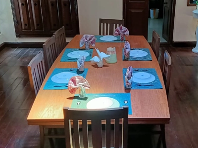 Traditional dining area at Shantiniketan Villa in Coonoor with vintage charm and spacious seating for guests