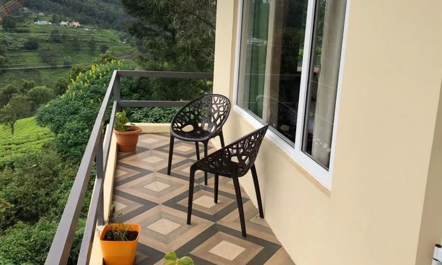 Watch stunning sunset views over the mountains from De Castle Villa, a peaceful luxury stay in Coonoor