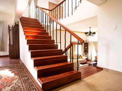 Enjoy a warm, inviting villa with stylish stairs linking cozy living and dining spaces there at Kotagiri.