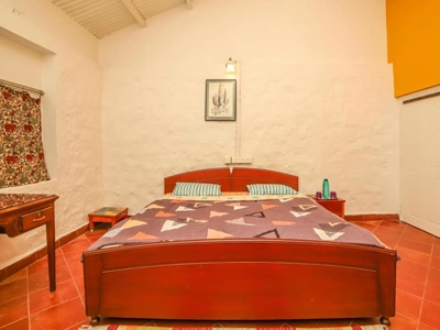 Enjoy a premium stone villa bedroom with scenic views and modern comforts at Rico Retreat in Kotagiri