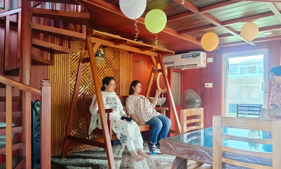 Enjoy a comfortable living room in Alleppey houseboat with beautiful backwater views and cozy ambiance
