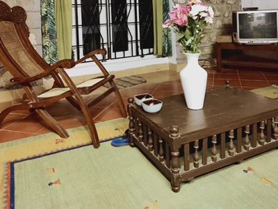 Relax in the spacious hall at Rico Retreat, a scenic holiday homestay nestled in the hills of Kotagiri