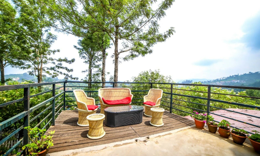 Nature-facing sitting area at Pembroke Villa, ideal for relaxation, reading, or peaceful tea breaks